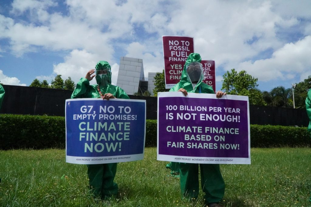 Image of activists and climate finance