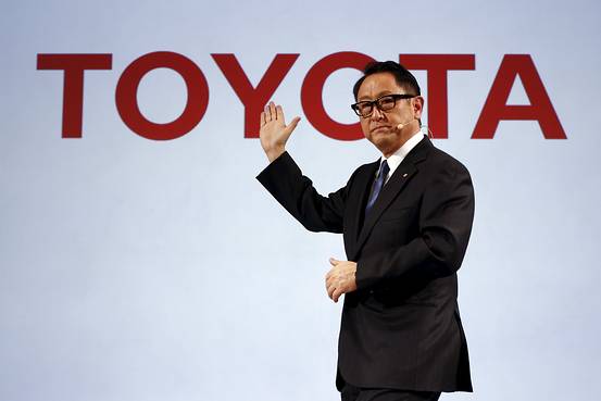 Akio Toyoda giving a presentation on Toyota.